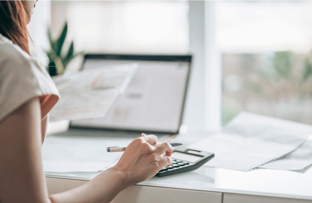 A woman using a calculator